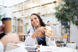© Sam Edwards/Caia Image - Businesswoman drinking coffee in meeting