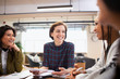 © Sam Edwards/Caia Image - Smiling businesswomen talking in meeting