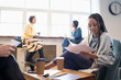© Sam Edwards/Caia Image - Businesswomen working, meeting in office