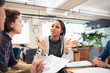 © Sam Edwards/Caia Image - Businesswomen talking in meeting