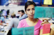 © Tom Merton/Caia Image - Focused businesswoman with adhesive notes planning in office