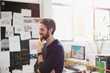 © Tom Merton/Caia Image - Happy creative businessman rubbing beard in office