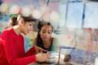 © Tom Merton/Caia Image - Female engineers examining prototype