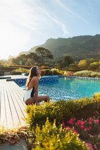 Serene Woman In Bathing Suit Relaxing At Idyllic, Tranquil Swimming Pool, Cape Town, South Africa
