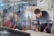 © Tom Merton/Caia Image - Creative businessman writing on whiteboard, planning and brainstorming in office