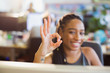 © Tom Merton/Caia Image - Portrait confident, ambitious businesswoman gesturing OK with hand in office