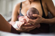 © Sam Edwards/Caia Image - Mother breastfeeding newborn baby son