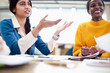 © Sam Edwards/Caia Image - Businesswomen talking in conference room meeting