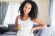 © Sam Edwards/Caia Image - Portrait happy young pregnant woman drinking healthy green smoothie