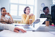 © Sam Edwards/Caia Image - Businesswomen listening in conference room meeting