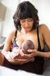 © Sam Edwards/Caia Image - Mother breastfeeding newborn baby son