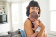 © Sam Edwards/Caia Image - Portrait beautiful mother holding newborn baby son