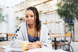 © Sam Edwards/Caia Image - Portrait confident businesswoman drinking coffee