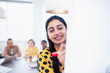 © Sam Edwards/Caia Image - Smiling businesswoman leading conference room meeting