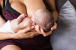 © Sam Edwards/Caia Image - Close up mother breastfeeding newborn baby son