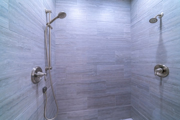 Wall Mural - Tiled shower cubicle with dual heads bright interior