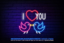 Love Birds Neon Sign. Glowing Neon Two Birds And A Pink Heart Against A Brick Wall. Valentine's Day Neon Light Glowing Bright Bird Love And Alphabet Set Neon Blue Color Design