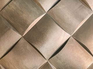 Bronze 3D interior decorative wall panel with unusual geometric shape.