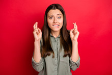 Close-up Portrait Of Her She Nice Attractive Worried Nervous Scared Straight-haired Girl In Khaki Shirt Praying Crossed Fingers Isolated On Bright Vivid Shine Vibrant Red Color Background