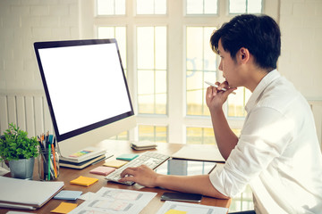 Wall Mural - mock up. designer man with computer and laptop planning application for mobile phone. ux ui designer