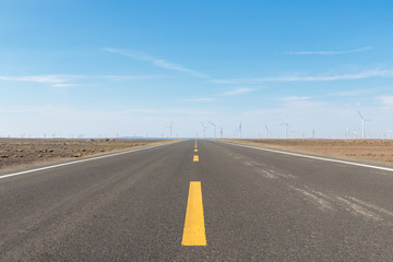 Wall Mural - road through the wind farm