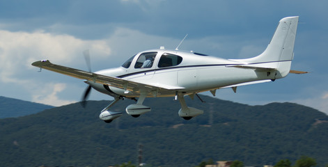 Image of sports plane flying rapidly  in the sky, outdoor