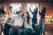© deagreez - Photo of group amazing friends meeting surprise baby party wedding anniversary future parents sit sofa hold big cake kissing confetti fall formalwear restaurant indoors