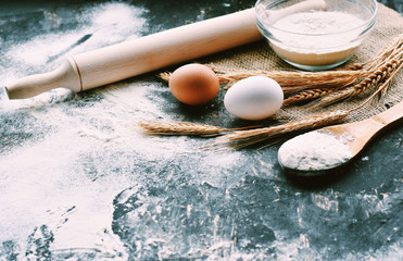 flour and eggs on wooden table