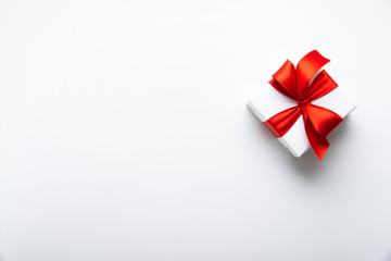 Wall Mural - white gifts with red ribbon, present on white background top view. happy holidays. valentine's day. 