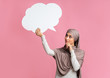 © Prostock-studio - Empty speech bubble in hands of thoughful islamic girl in hijab