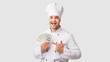 © Prostock-studio - Chef Man Holding Money Pointing Finger Standing Over White Background