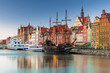 Beautiful scenery of the old town in Gdansk over Motlawa river at dawn, Poland.