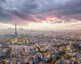 Fototapeta Uliczki - Panorama of Paris with Eiffel Tower against sunset in France