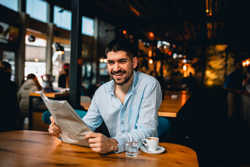 Poster - man reading newspapers and drinking coffee in cafeteria