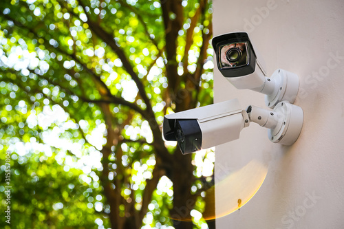 Outdoor CCTV monitoring, security cameras with sunlight flare. Poster Mural XXL