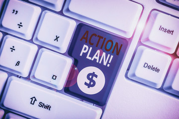 Writing note showing Action Plan. Business concept for proposed strategy or course of actions for certain time White pc keyboard with note paper above the white background