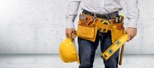 Man Worker And Professional Builder With Tools