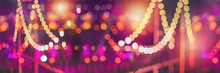 Blurred Bokeh Festival Night Light Of City. Abstract Colourful Evening Lights Background.