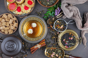 Tea hot drink on old background in composition on the table