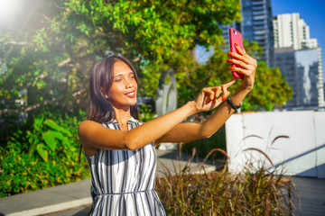 Sticker - Asian woman teking selfies visiting the city