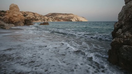 Wall Mural - sea waves roll ashore between the rocks