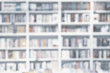 Abstract blurred bookshelves with books, manuals and textbooks on bookshelves in library or in book store, soft focus. Concept of learning, school, culture, education