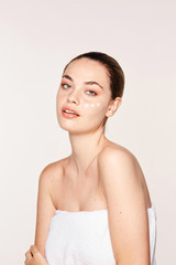 Pretty woman with cream on face