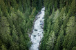 © Pol Sole/ADDICTIVE STOCK - From above fast foamy river mountain stream rushing through dozens of evergreen forests in Switzerland