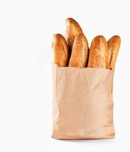 Baguette Bread In Paper Bag On White Background