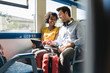 © Westend61 - Happy young couple using tablet in a train