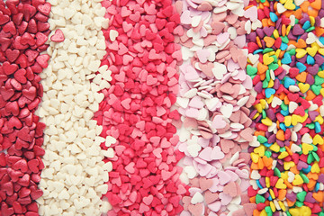 Wall Mural - Background of colorful heart shaped sprinkles