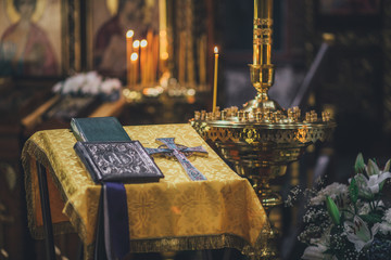 Church ordinance orthodox and wedding, church wedding, religious of a child in church, icons, Orthodox church, candles, interior of the Orthodox Church, bible, font