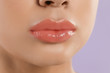 © New Africa - Young woman with beautiful full lips on lilac background, closeup