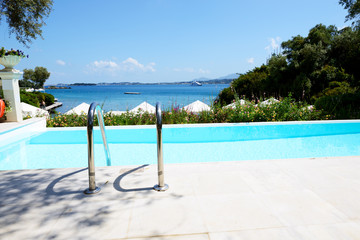 Wall Mural - The view on swimming pool and beach, Corfu island, Greece